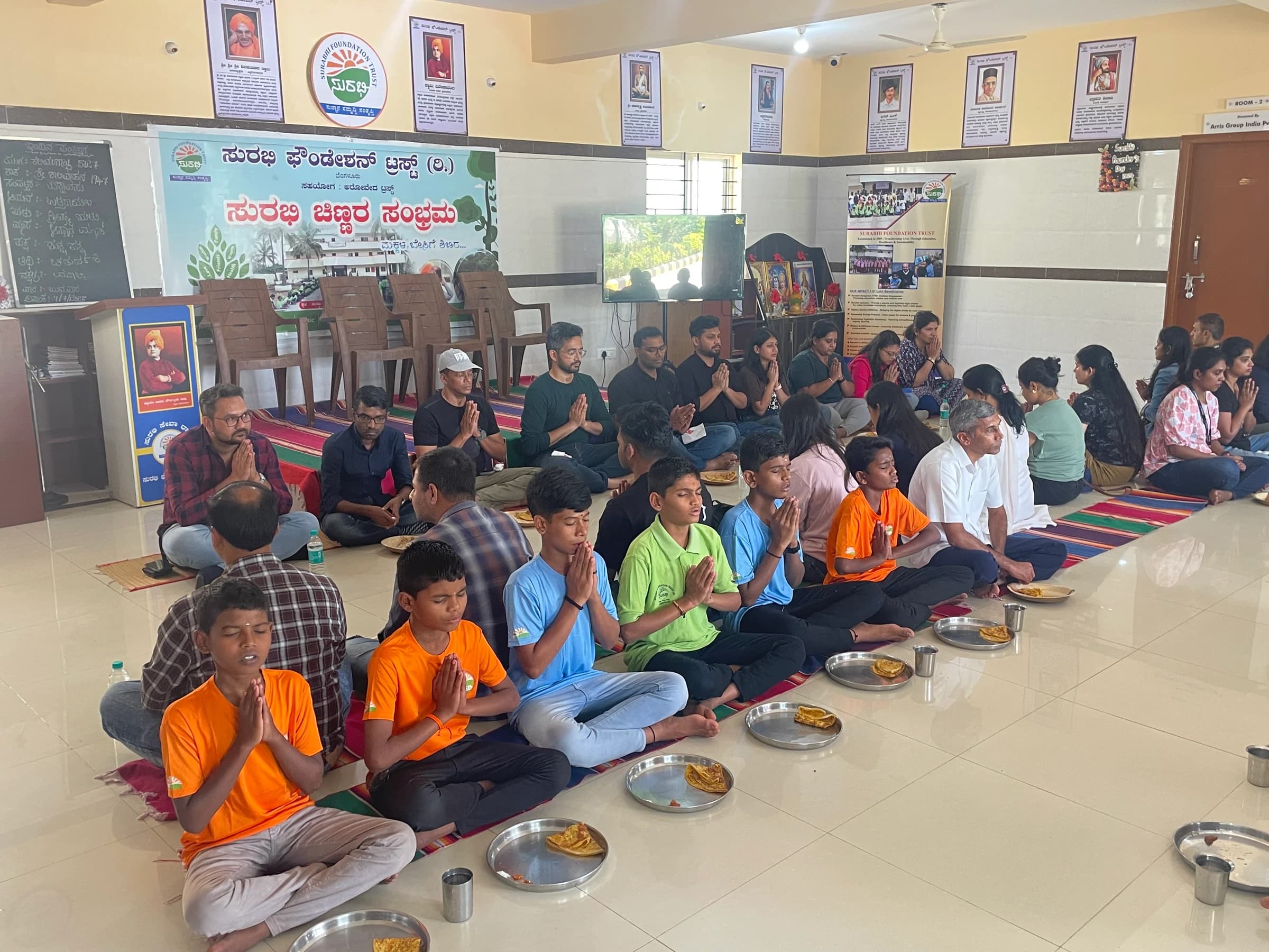 Children and supporters gathered during a community visit