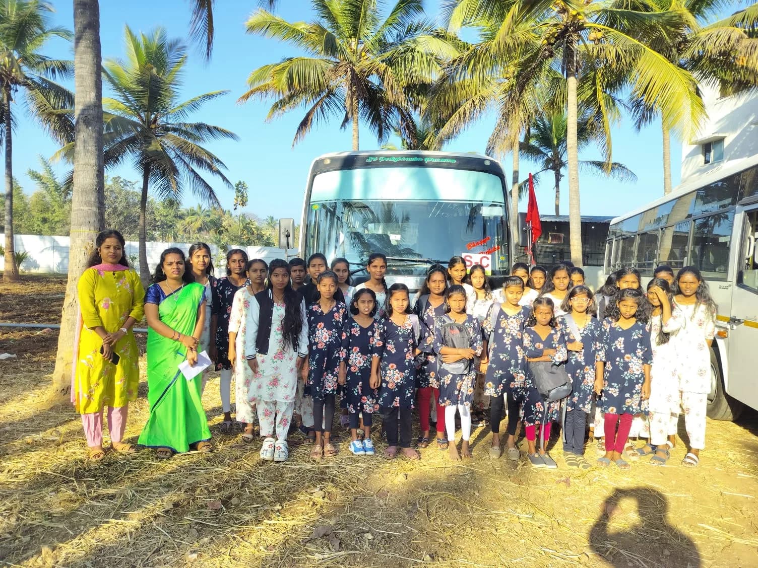 A school community gathered during a visit